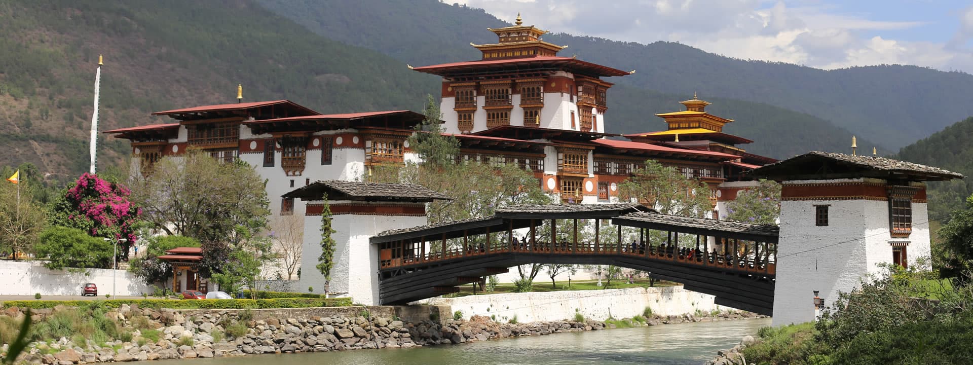 Punakha Dzong and its traditional cantilever bridge over the Mo Chhu river